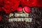 rosted coffee beans with red macaroon red flowers and letters I LOVE Coffee