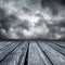 Rostrum made of wooden planks on stormy sky