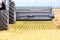 Rotary bucket of a large combine harvester, harvesting wheat on a summer day