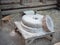 Rotary discoid mill stone for hand-grinding a grain into flour. Medieval hand-driven millstone grinding wheat. The