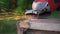 Rotary flex cutter cutting rusty nail on old wooden frame, sparks flying in air, closeup detail, slow motion video