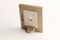 Rotary miniature wooden frames cut for photographs or paintings, photographed on a white background