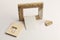 Rotary miniature wooden frames cut for photographs or paintings, photographed on a white background