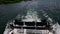 Rotating black paddle wheel of a cruise boat in motion. Slow motion footage