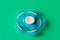 Rotating blue spinner . Isolated on turquoise background