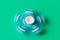 Rotating blue spinner . on turquoise background