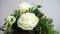 Rotating bunch of flowers with white roses