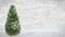 Rotating Christmas tree on winter background with snowfall animation. 3D render.seamless loop