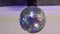 rotating disco ball on the ceiling of the room