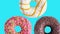 Rotating donuts colorful animation on blue background