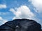 Rotating, flower shaped solar panel detail with blades under blue sky