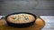 Rotating of fresh-cooked tasty apple berry pie in a pan, close up, 4K