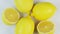 Rotating fresh lemons on a white background