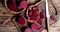 Rotating fresh pieces of beets on cutting board.