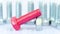 Rotating group of galvanized metallic screws close-up, one of them pink colored.