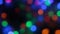 Rotating multicolored bokeh lights. Christmas and new year lights twinkling.