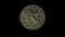 Rotating obverse of Malta coin 10 cents 1972. Isolated in black background.