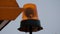 Rotating orange flash light at the road sweeper