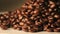 Rotating pile of coffee beans zoomed in