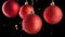 Rotating Red Christmas Bauble on Black Festive Backdrop.