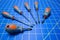 Rotating of Screwdrivers on Blue Stationary Mat