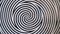 Rotating spiral circles.