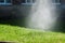Rotating sprinkler system watering the lawn