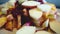 Rotating view of a pile of fresh fruit on a wooden board