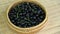 Rotating wicker basket with black nightshade Solanum nigrum berries