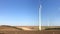 Rotating wind turbine towers on fields produce energy