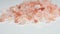 Rotation of raw Himalayan pink salt crystals.