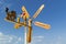 Rotation of a wooden weather vane with figures of people and painted blades against