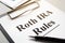 Roth IRA rules with stack of papers