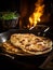 Roti or chapatti cooking in a non-stick frying pan in the kitchen