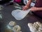 Roti Making, roti thresh flour by roti maker with oil. Indian traditional street food