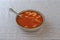 Rotini tomato soup in a bowl on a tablecloth