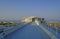 Rotonda al mare during sunrise across the sky and the beach with sun umbrellas, long road in Senigallia, Italy