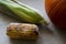 Rotten corn on the table next to the pumpkin