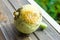 Rotten pumpkin due to dampness on a wooden windowsill in the garden