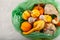 Rotten spoiled pumpkins in plastic garbage bag. Ugly moldy vegetables. Improper food storage. Concept - reduction of organic waste