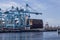 Rotterdam, Holland. Aerial view of container terminal in the harbor MAASVLAKTE, Netherlands. A large containership is unloading