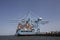 Rotterdam, The Netherlands. View of a large containership docked in the container terminal loading and unloading containers on