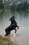 Rottweiler Dog, Male Leaping in Water