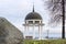 Rotunda on shore of lake in winter