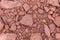 Rouge rock for road reclamation work. Laterite Pattern. lateritic soil textured background. Background of broken pottery. Cracked