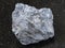 rough antimony ore (Stibnite) stone on dark