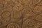 Rough brown spiral patterned background