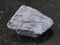 rough chromite stone on dark background