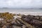 Rough coarse stone coastline and powerful ocean wave. West coast of Ireland. Irish nature landscape. Connemara area