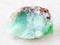 rough crystal of Chrysoprase gemstone on white